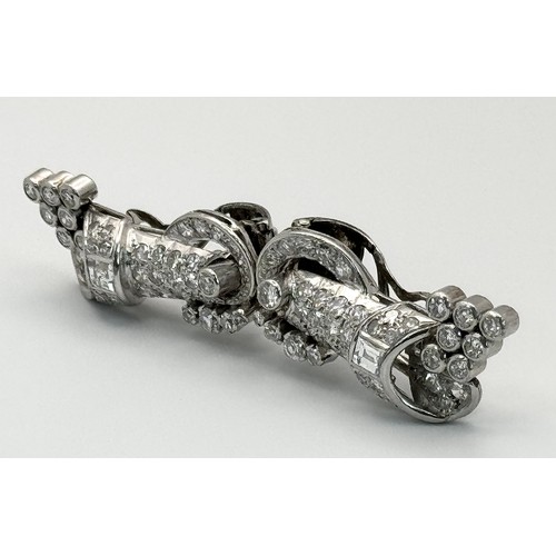 46 - A Gorgeous Art Deco Platinum and Diamond Brooch. Twin scrolled cones with an array of diamond decora... 