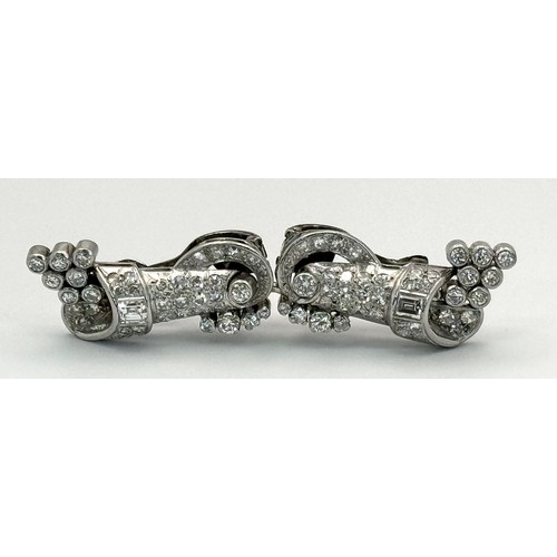 46 - A Gorgeous Art Deco Platinum and Diamond Brooch. Twin scrolled cones with an array of diamond decora... 