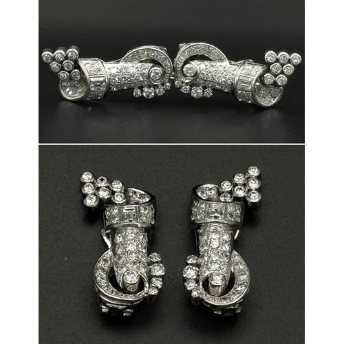 46 - A Gorgeous Art Deco Platinum and Diamond Brooch. Twin scrolled cones with an array of diamond decora... 