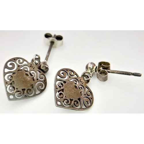 2014 - A Sterling Silver Stone-Set Heart Shape Necklace and Earrings Set. Please see photos for details.