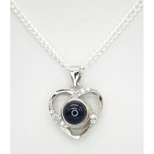 2094 - A Stone Set Silver Pendant on a Silver Chain. 10mm and 42cm.