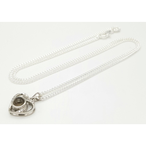 2094 - A Stone Set Silver Pendant on a Silver Chain. 10mm and 42cm.