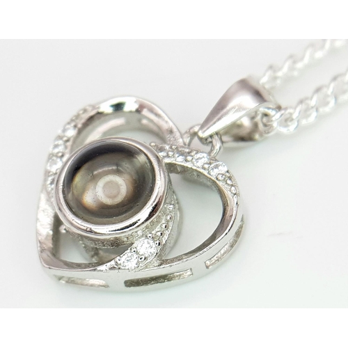 2094 - A Stone Set Silver Pendant on a Silver Chain. 10mm and 42cm.