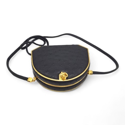 249 - An Asprey of London Black Ostrich Shoulder Bag. Comes with original Asprey box and mirror. Gilded ha... 