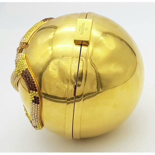 396 - Rare Valentino Gold Orb Clutch Bag. Metal exterior with a stone embellished V logo and clasp fasteni... 