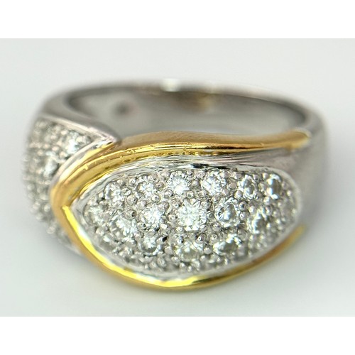 263 - A Gorgeous 18K Gold, Platinum Pave Diamond Ring. Overlap form with bright pave diamonds. Size L. 9.1... 