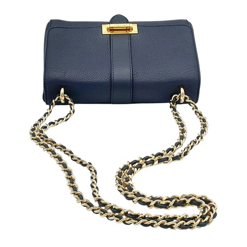 403 - An Aspinal of London Blue Lottie Letterbox Bag. Leather exterior with gold-toned hardware, chain and... 