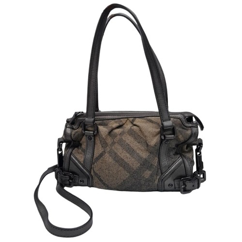 1080 - A Burberry Metallic Grey Smoke Check Bag. Canvas exterior with leather trim, leather straps, black-t... 