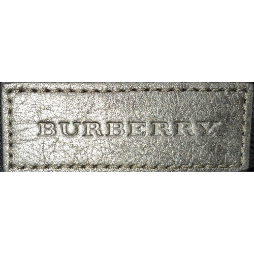 1080 - A Burberry Metallic Grey Smoke Check Bag. Canvas exterior with leather trim, leather straps, black-t... 