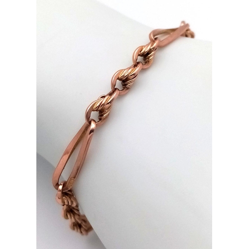 50 - A 9K rose Gold Twisted Bar and Knot Link Bracelet with a yellow gold Heart padlock Clasp. 18cm. 11.0... 