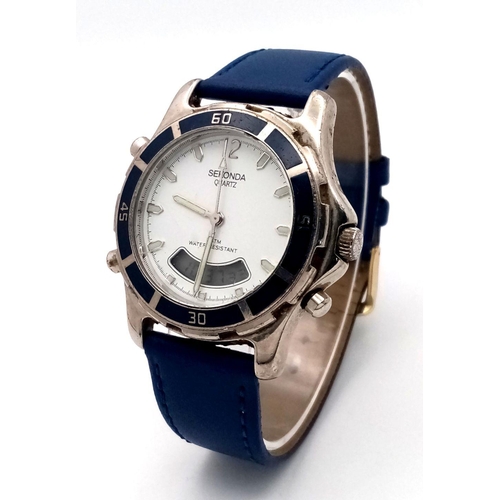 1563 - A Sekonda Dual Watch. Digital and analogue quartz. Blue leather strap. Case - 38mm. In working order... 