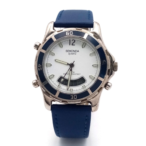 1563 - A Sekonda Dual Watch. Digital and analogue quartz. Blue leather strap. Case - 38mm. In working order... 