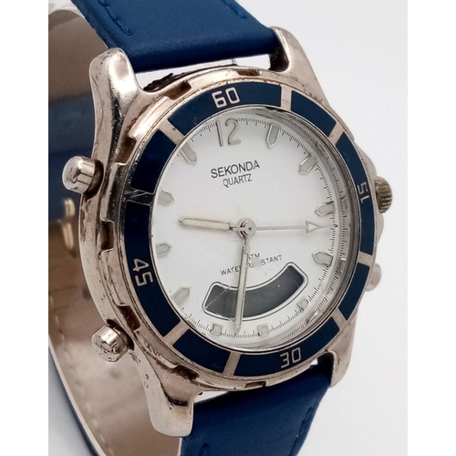 1563 - A Sekonda Dual Watch. Digital and analogue quartz. Blue leather strap. Case - 38mm. In working order... 