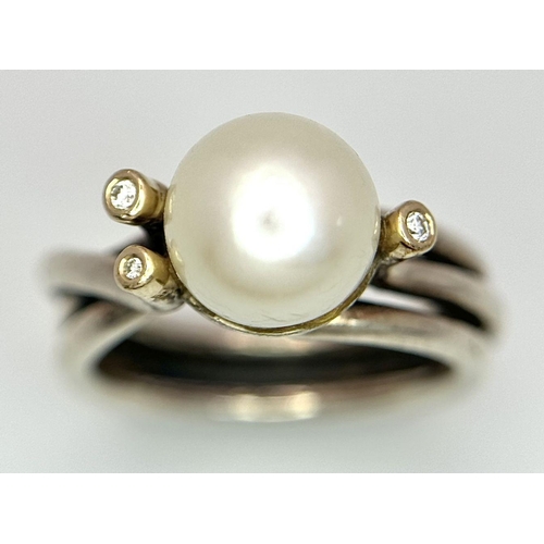 1636 - A fashion 925 silver Pearl centre and stone set ring. Total weight 7.9G. Size O.