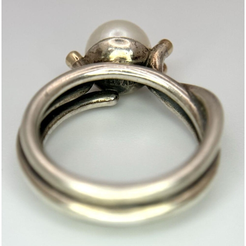 1636 - A fashion 925 silver Pearl centre and stone set ring. Total weight 7.9G. Size O.