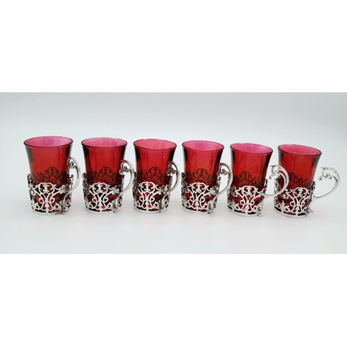 164 - Rarely seen in such condition a complete set of six antique small cranberry glasses with sterling si... 