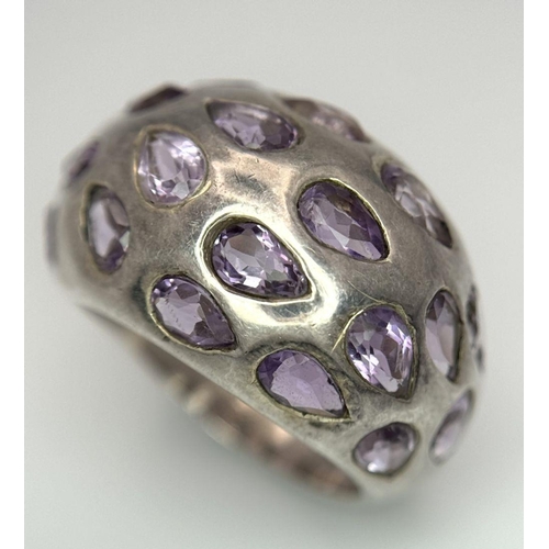 1650 - A fancy 925 silver Amethyst ring. Total weight 10.1G. Size P/Q.