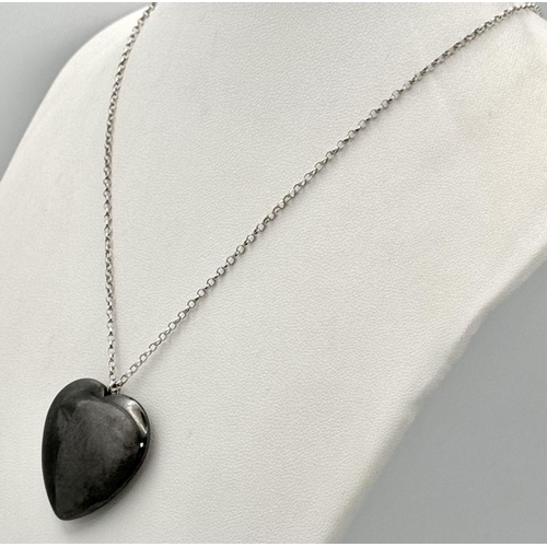 1818 - A Hematite large Heart pendant on 925 silver belcher chain. Total weight 23.9G. Total length 52cm.