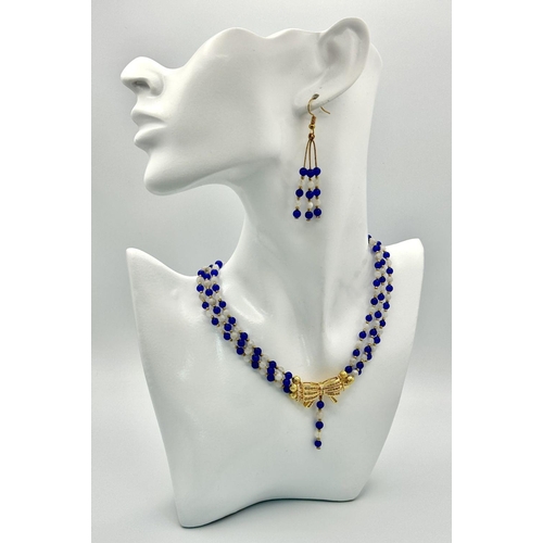 206 - A feminine and sophisticated three row necklace with moonstone and blue sapphires accompanied by a p... 