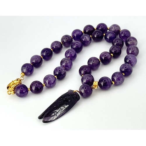 234 - An exquisite, amethyst necklace and earrings set with pendant cicadas. Necklace length: 47 cm, earri... 