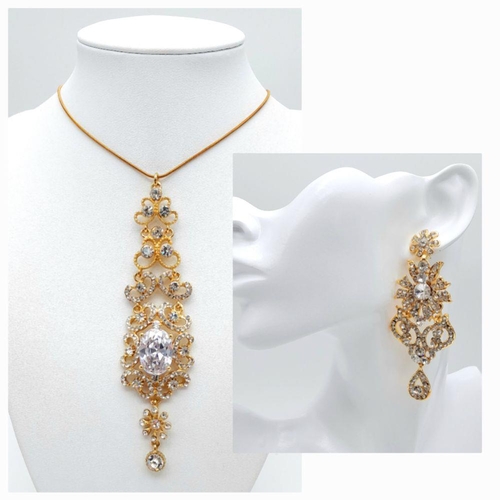 255 - A very regal set of a pair of earrings and matching pendant with chain. Studded with cubic zirconia ... 