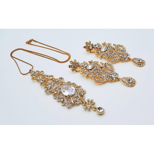 255 - A very regal set of a pair of earrings and matching pendant with chain. Studded with cubic zirconia ... 