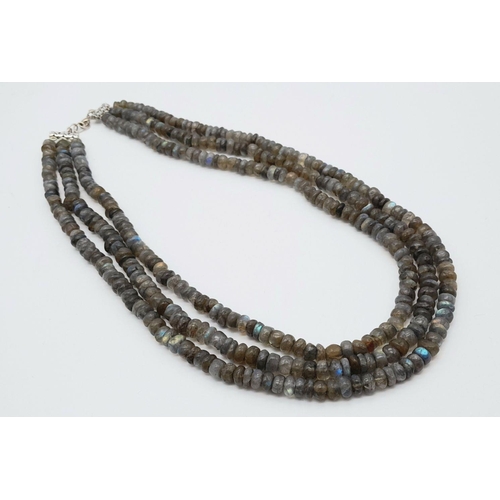 262 - A top quality three-strand labradorite (variety blue flash) necklace, exhibiting excellent iridescen... 