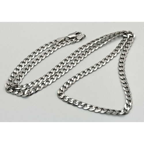 324 - A 9k White Gold Curb Link Chain. 55cm. 18.1g weight. In very good condition.