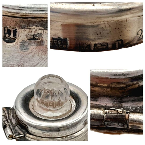 786 - An Antique Silver Top Glass Perfume Bottle. Hinge is broken so as found. Faded hallmarks. 12cm tall.