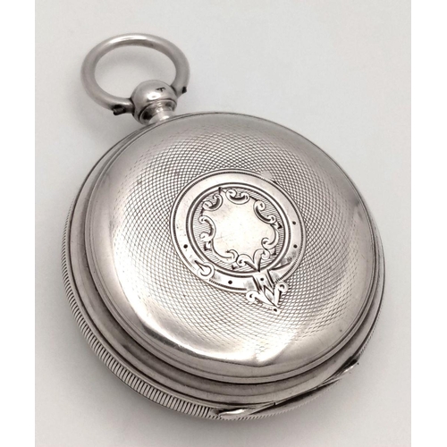 821 - An Antique Sterling Silver Pocket Watch - With Key. Chester hallmarks for 1891. White dial with seco... 