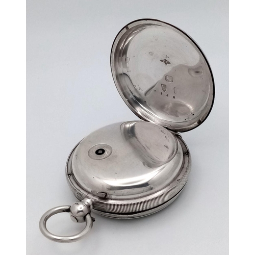 821 - An Antique Sterling Silver Pocket Watch - With Key. Chester hallmarks for 1891. White dial with seco... 