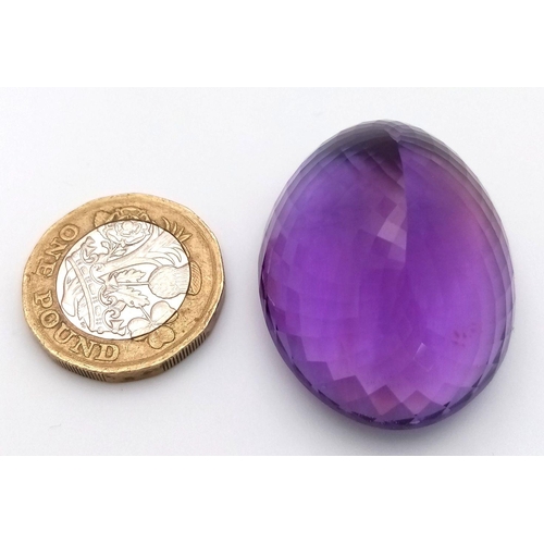 1101 - A 139.65ct natural amethyst gemstone in a rare collector's size, in oval mixed cut. Comes with IGITL... 