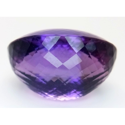 1101 - A 139.65ct natural amethyst gemstone in a rare collector's size, in oval mixed cut. Comes with IGITL... 