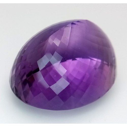 1101 - A 139.65ct natural amethyst gemstone in a rare collector's size, in oval mixed cut. Comes with IGITL... 