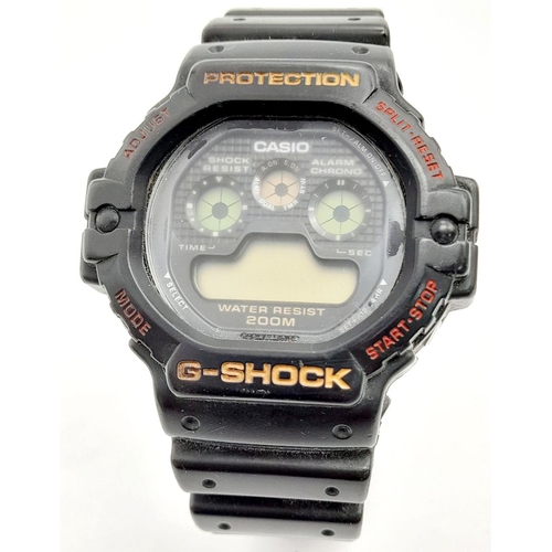 1220 - A Vintage G-Shock Watch. Black rubber strap. 47mm case. As found.