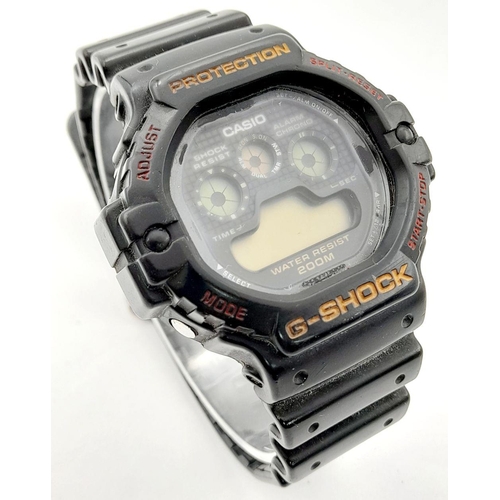 1220 - A Vintage G-Shock Watch. Black rubber strap. 47mm case. As found.