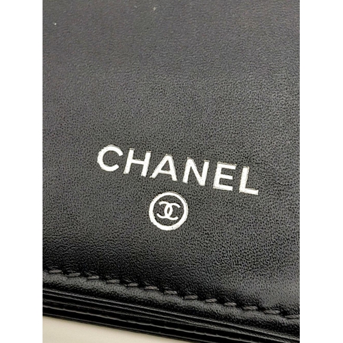 151 - A Chanel Black Caviar Timeless CC Long Wallet. Black caviar leather exterior with silver-toned hardw... 