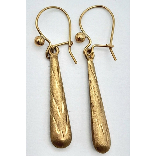 1633 - A Pair of 9K Yellow Gold Drop Earrings in Conical Form. 3.5cm. 0.75g total weight.