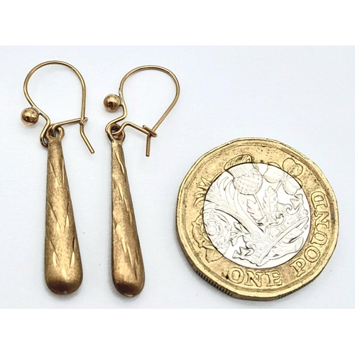 1633 - A Pair of 9K Yellow Gold Drop Earrings in Conical Form. 3.5cm. 0.75g total weight.