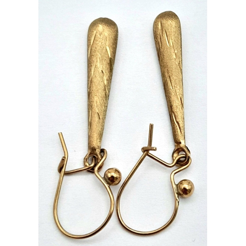 1633 - A Pair of 9K Yellow Gold Drop Earrings in Conical Form. 3.5cm. 0.75g total weight.