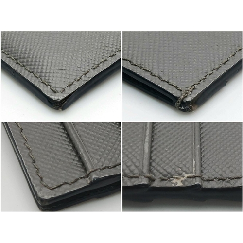 193 - A Prada Grey Saffiano Leather Card Holder. Grey Saffiano leather exterior. Grey leather interior wit... 