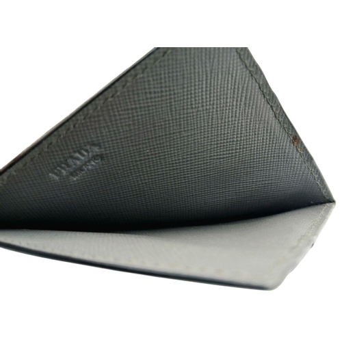 193 - A Prada Grey Saffiano Leather Card Holder. Grey Saffiano leather exterior. Grey leather interior wit... 