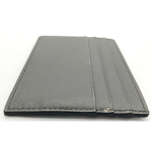 193 - A Prada Grey Saffiano Leather Card Holder. Grey Saffiano leather exterior. Grey leather interior wit... 