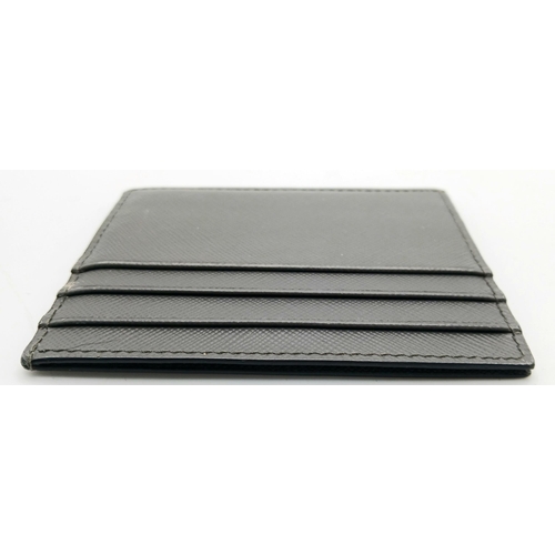 193 - A Prada Grey Saffiano Leather Card Holder. Grey Saffiano leather exterior. Grey leather interior wit... 