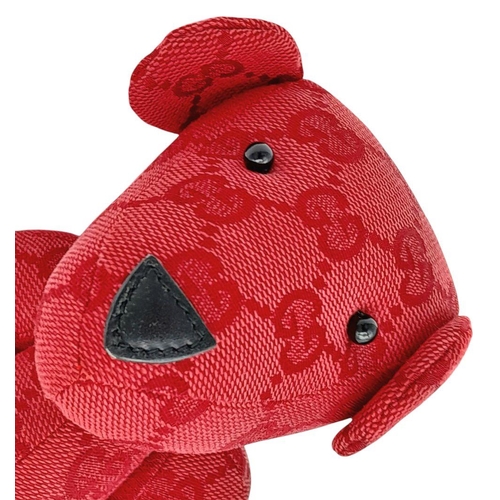 200 - A Gucci Red Teddy Bear Plush Toy. Monogram canvas exterior. Approximately 26cm length. Fixable damag... 