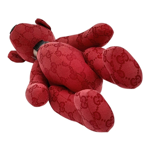 200 - A Gucci Red Teddy Bear Plush Toy. Monogram canvas exterior. Approximately 26cm length. Fixable damag... 