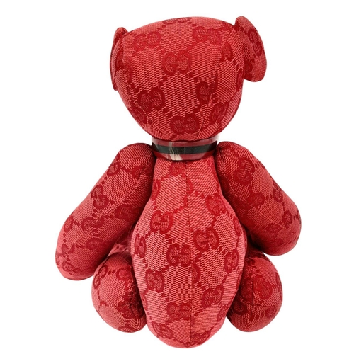 200 - A Gucci Red Teddy Bear Plush Toy. Monogram canvas exterior. Approximately 26cm length. Fixable damag... 