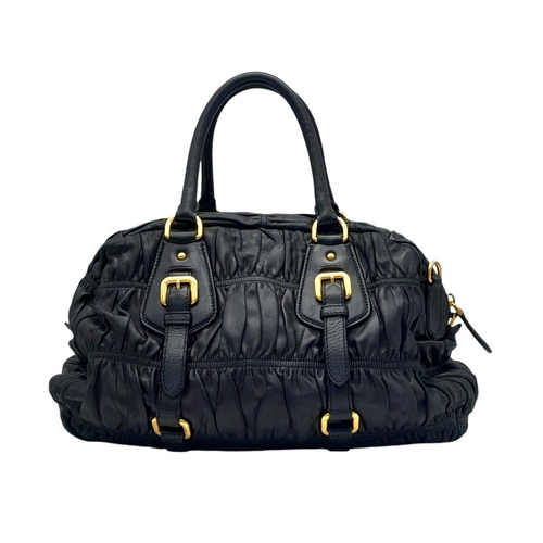 207 - A Prada Black Leather Tote Bag. Ruched leather exterior with gold-toned hardware, dual rolled leathe... 