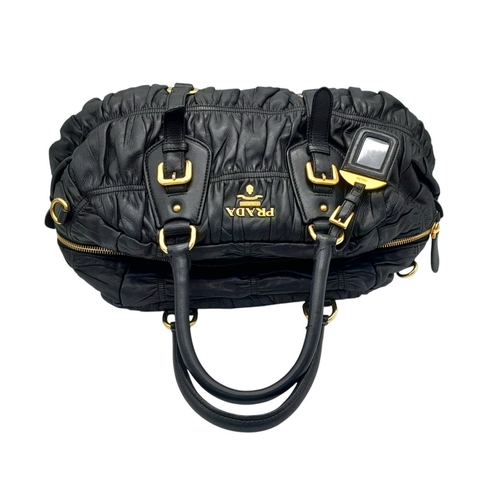 207 - A Prada Black Leather Tote Bag. Ruched leather exterior with gold-toned hardware, dual rolled leathe... 