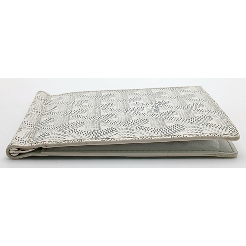 221 - A Goyard Victoire White Wallet. White canvas exterior with Goyardine monogram pattern and silver-ton... 